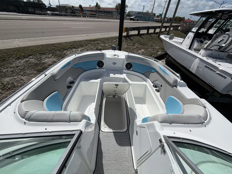 Slide: The Image of Interior of 2026 Hurricane 2400 SD boat with blue and gray seating. - 22