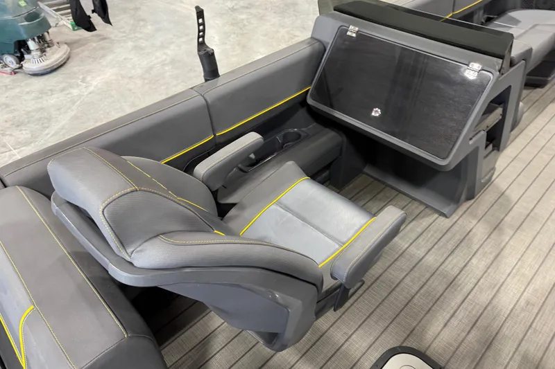 Slide: The Image of Luxurious seating on 2025 Manitou 24 Explore boat with sleek design and modern features. - 7