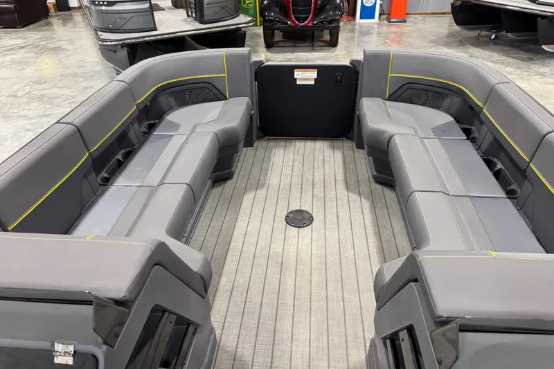 Slide: The Image of Interior of 2025 Manitou 24 Explore pontoon boat with spacious seating and modern design. - 8