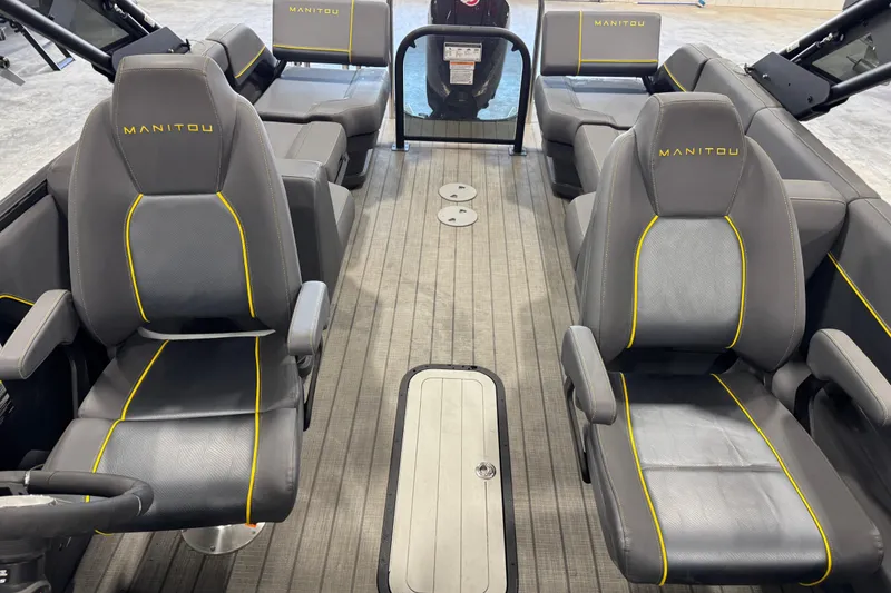 Slide: The Image of Interior of 2025 Manitou 24 Explore boat with sleek seating and modern design. - 9