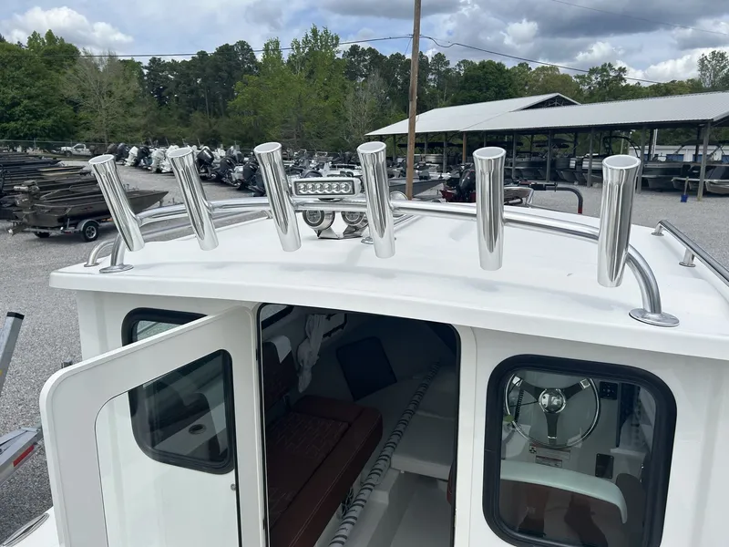 Slide: The Image of Parker 217 Explorer 2026 with AC, open cabin, fishing rod holders. - 7