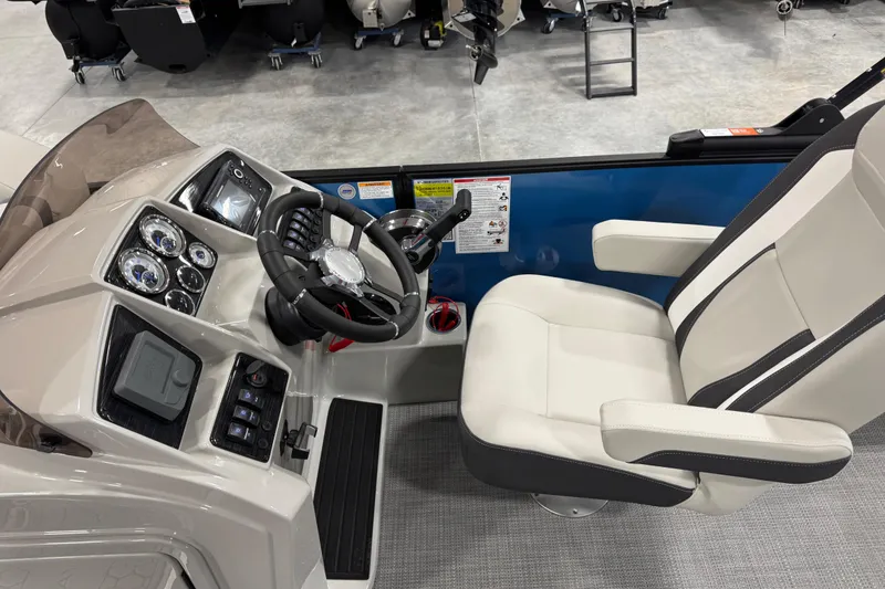Slide: The Image of 2026 Sylvan Mirage X X5 boat cockpit with modern steering and comfortable seating. - 10