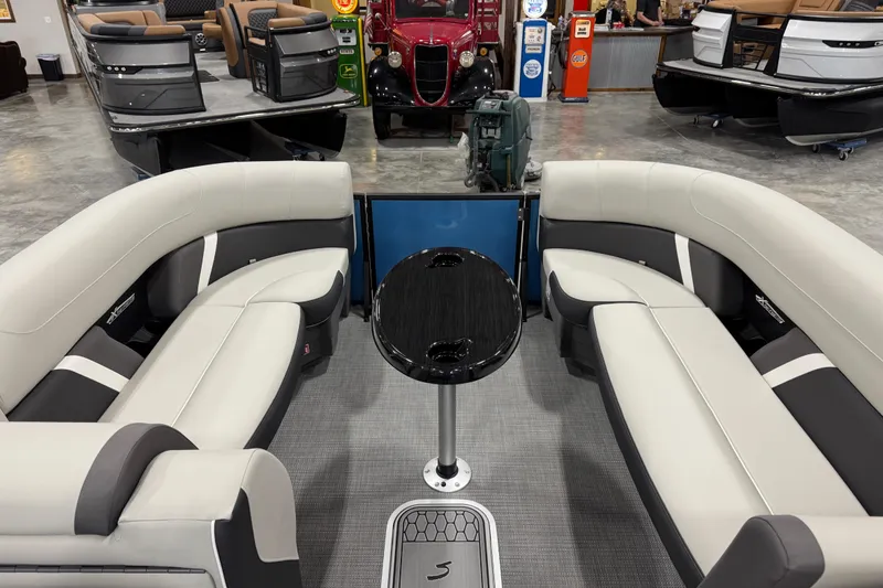 Slide: The Image of Luxurious interior of 2026 Sylvan Mirage X X5 pontoon boat with sleek seating and table. - 11