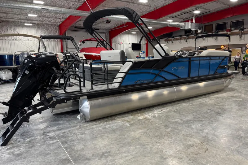 Slide: The Image of 2026 Sylvan Mirage X X5 pontoon boat in showroom, featuring sleek design and modern amenities. - 4