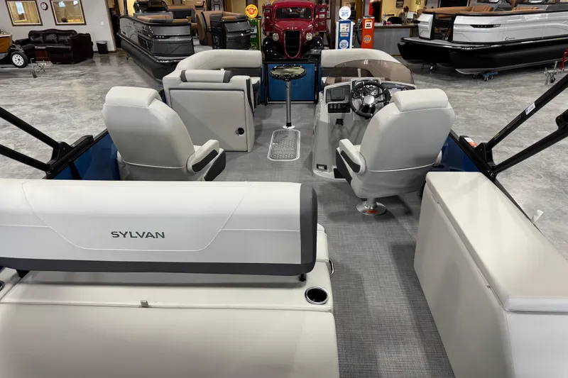 Slide: The Image of Interior view of 2026 Sylvan Mirage X X5 pontoon boat in showroom. - 7