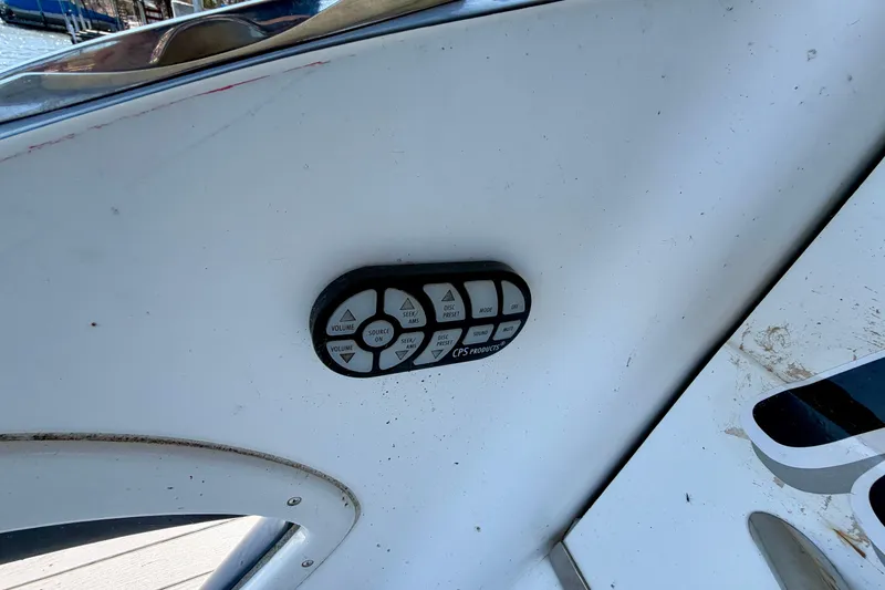 Slide: The Image of Control panel on a 2005 Cobalt 282 boat dashboard, featuring various buttons. - 24