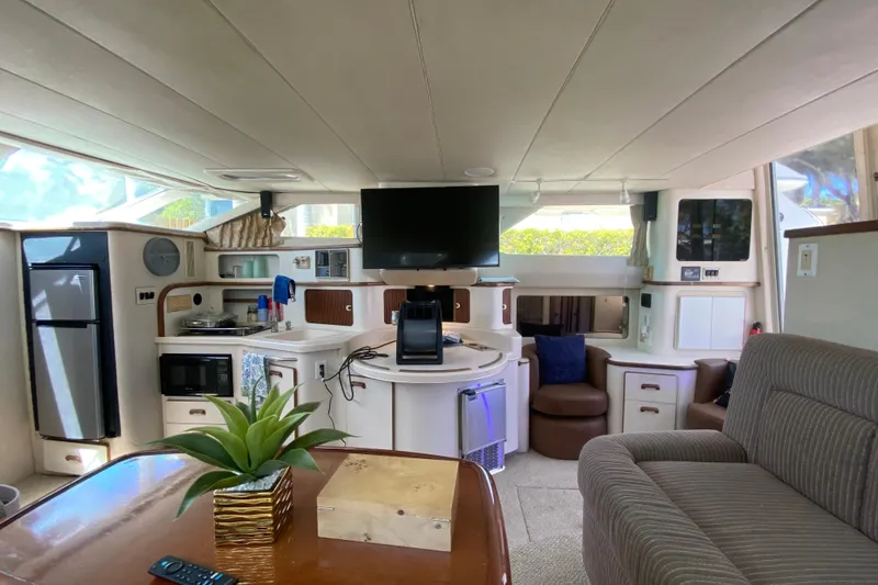Slide: The Image of Luxurious interior of 1994 Sea Ray 440 Express Bridge yacht with modern amenities. - 24