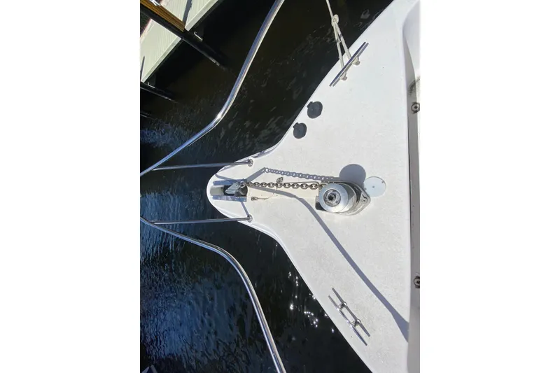 Slide: The Image of Bow of 1994 Sea Ray 440 Express Bridge with anchor chain and winch. - 9