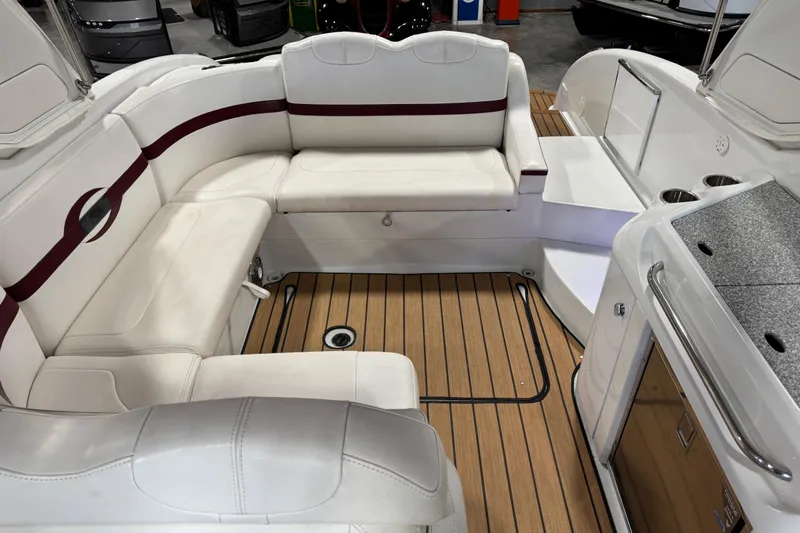 Slide: The Image of Luxurious interior of 2009 Formula 310 Bowrider with white seating and wood flooring. - 13