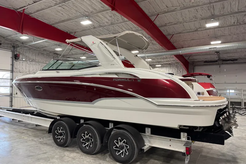 Slide: The Image of 2009 Formula 310 Bowrider boat on trailer in indoor storage facility. - 4