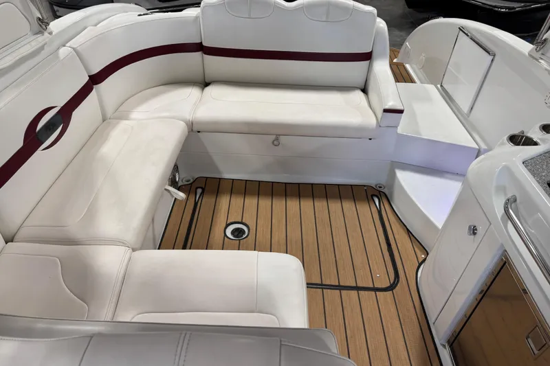 Slide: The Image of 2009 Formula 310 Bowrider interior with white seating and teak flooring. - 7