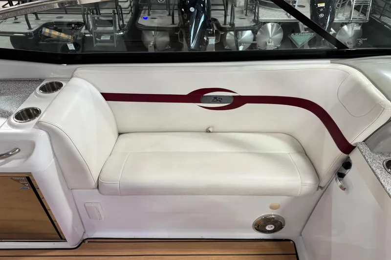 Slide: The Image of 2009 Formula 310 Bowrider interior with white seating and cup holders. - 8