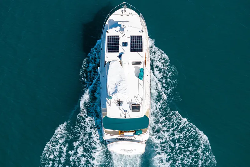 Slide: The Image of Aerial view of 1997 Nordic Tug 42 cruising on blue water. - 2
