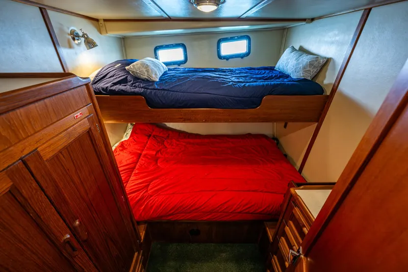 Slide: The Image of Cozy cabin with bunk beds in a 1997 Nordic Tug 42 boat interior. - 25