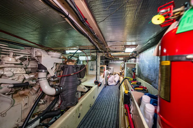 Slide: The Image of Engine room of a 1997 Nordic Tug 42, featuring machinery and equipment. - 30