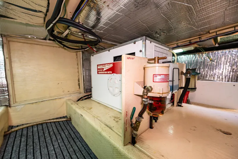 Slide: The Image of Engine room of 1997 Nordic Tug 42 with generator and fuel system. - 31