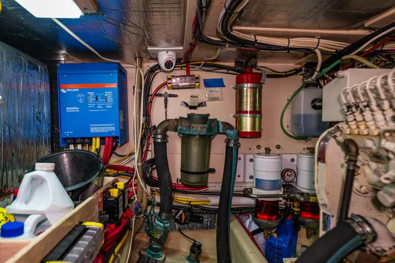 Slide: The Image of Engine room of a 1997 Nordic Tug 42, featuring electrical and mechanical components. - 37