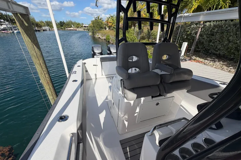 Slide: The Image of 2023 Cape Horn 32 XS boat interior with dual seats and water view. - 12