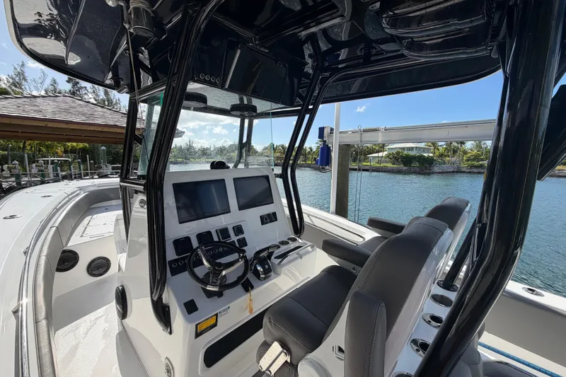 Slide: The Image of 2023 Cape Horn 32 XS boat cockpit with modern controls and dual screens. - 14