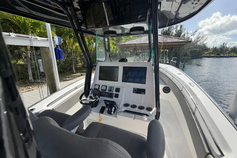 Slide: The Image of 2023 Cape Horn 32 XS boat cockpit with modern controls and steering wheel. - 15