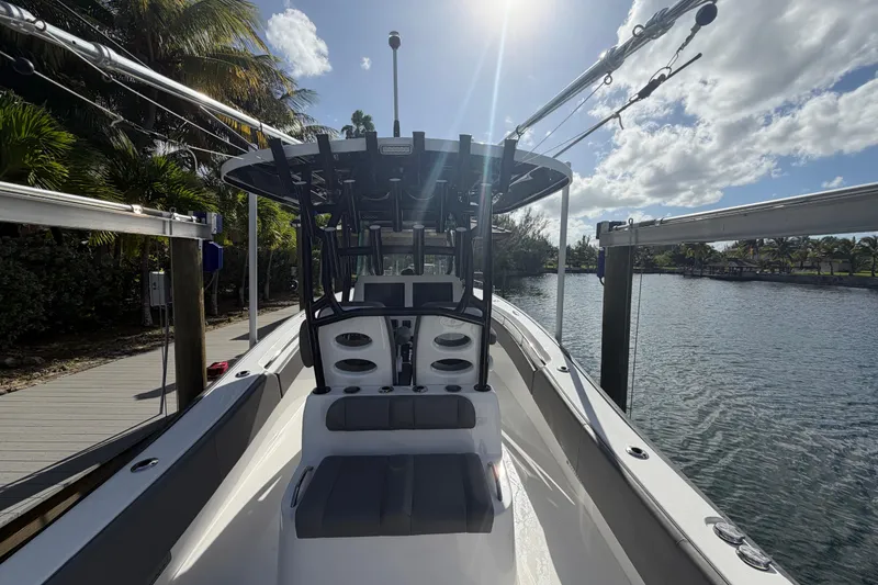 Slide: The Image of 2023 Cape Horn 32 XS boat docked by a scenic waterfront under a sunny sky. - 17