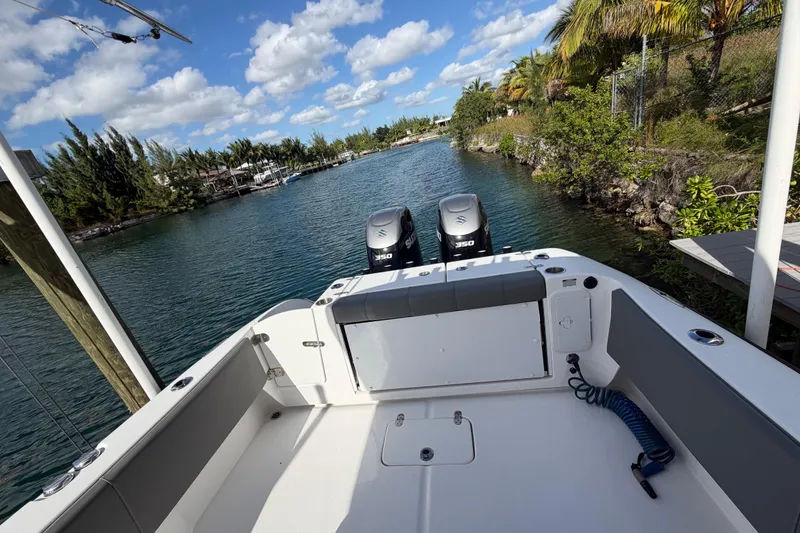 Slide: The Image of 2023 Cape Horn 32 XS boat with dual engines on a scenic waterway. - 18