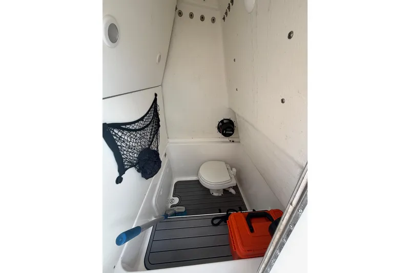 Slide: The Image of 2023 Cape Horn 32 XS boat interior with toilet and storage area. - 21