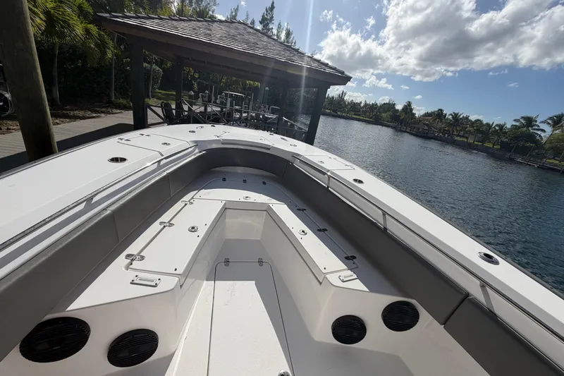 Slide: The Image of 2023 Cape Horn 32 XS boat docked by a scenic waterfront under a sunny sky. - 7