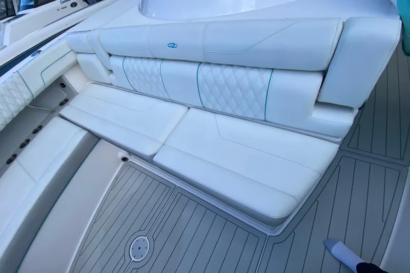 Slide: The Image of Luxurious white seating on 2021 Regal 38 SAV boat deck. - 17