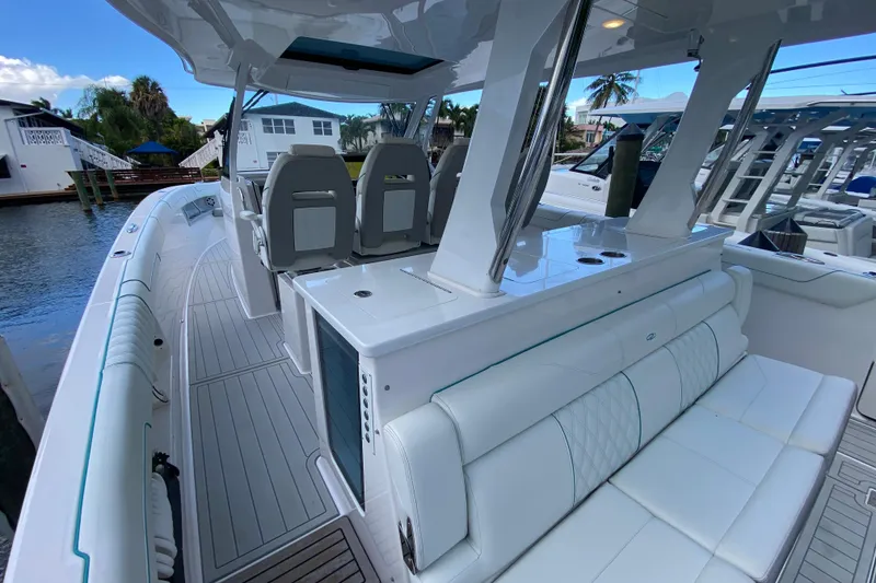 Slide: The Image of 2021 Regal 38 SAV boat interior with luxurious seating and sleek design. - 34