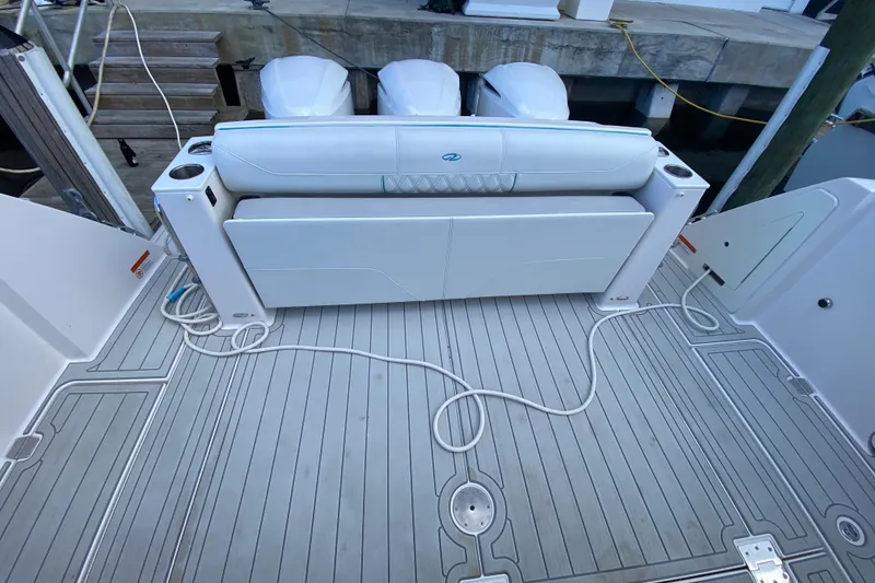 Slide: The Image of 2021 Regal 38 SAV boat deck with seating and outboard engines. - 36