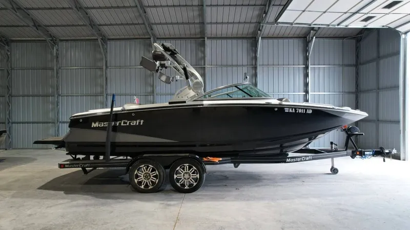 The Image of 2013 MasterCraft X-35 boat parked in a storage facility. - 1