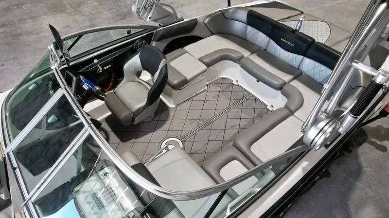 Slide: The Image of Interior of a 2013 MasterCraft X-35 boat with gray upholstery. - 12