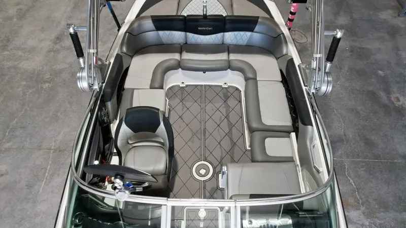 Slide: The Image of Interior of a 2013 MasterCraft X-35 boat, gray upholstery. - 13