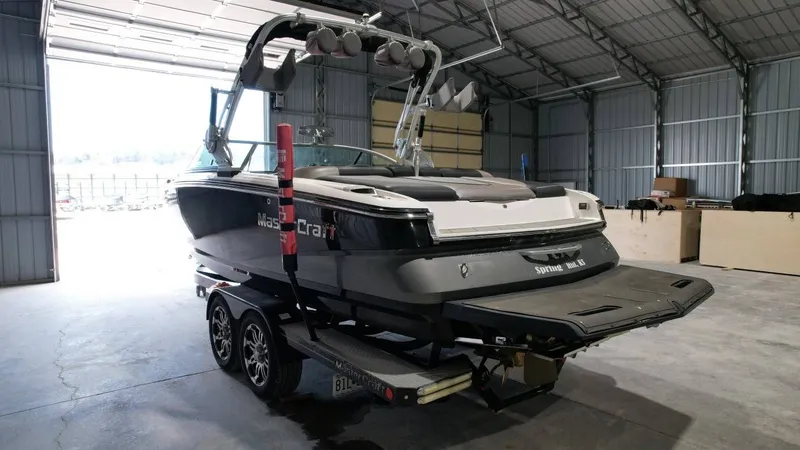 Slide: The Image of 2013 MasterCraft X-35 boat parked in a warehouse. - 5