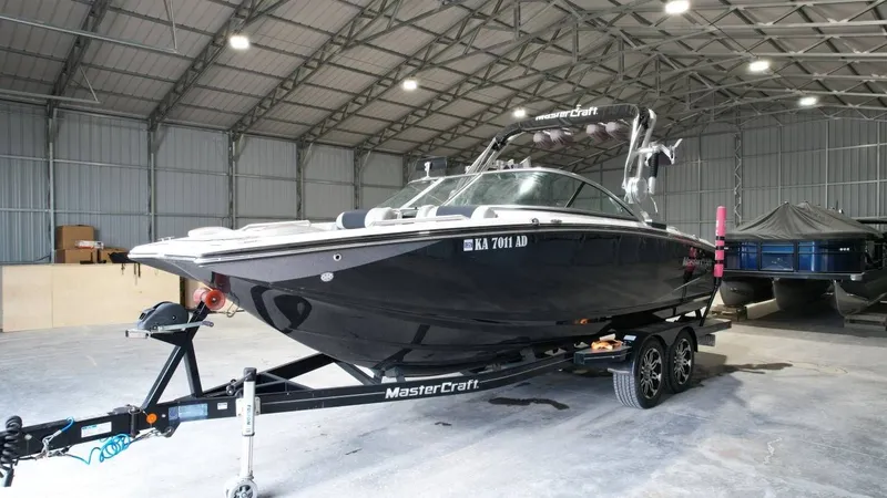 Slide: The Image of 2013 MasterCraft X-35 boat in warehouse on trailer. - 6