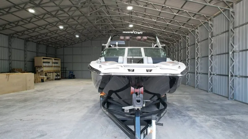 Slide: The Image of 2013 MasterCraft X-35 boat parked in a storage facility. - 7