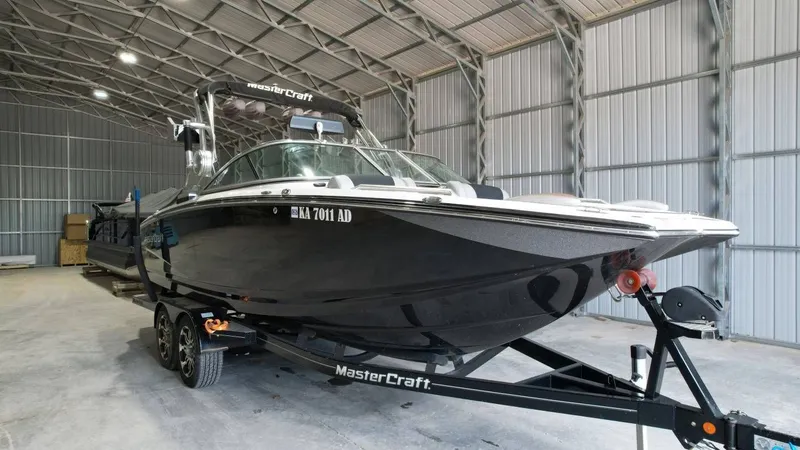 Slide: The Image of 2013 MasterCraft X-35 boat in warehouse on trailer. - 8