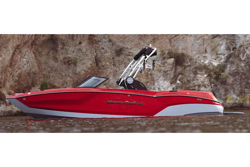 Slide: The Image of Manufacturer Provided Image: 2023 MasterCraft NXT23 boat in vibrant red on calm water. - 25