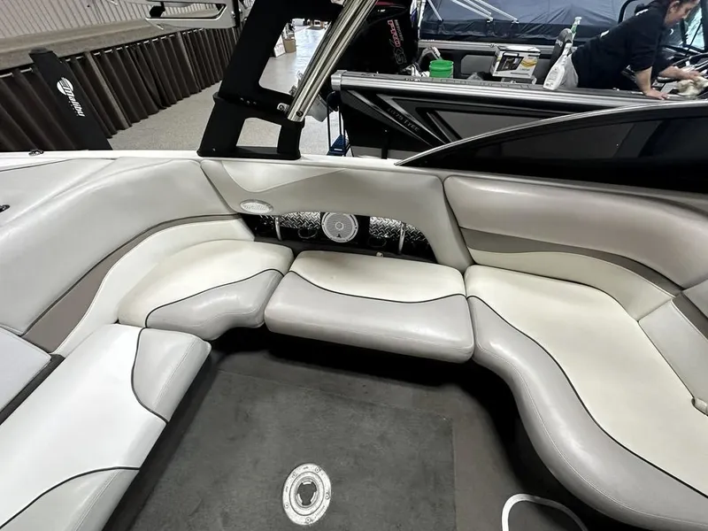 Slide: The Image of Interior of a 2005 Malibu Wakesetter VLX 21 boat with gray seating. - 13