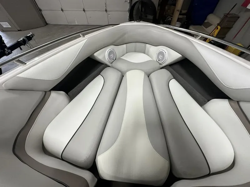 Slide: The Image of Interior of a 2005 Malibu Wakesetter VLX 21 boat with gray upholstery. - 6