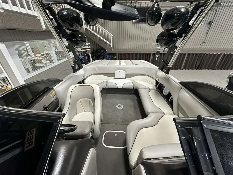 Slide: The Image of Interior of a 2005 Malibu Wakesetter VLX 21 boat with luxurious seating. - 8