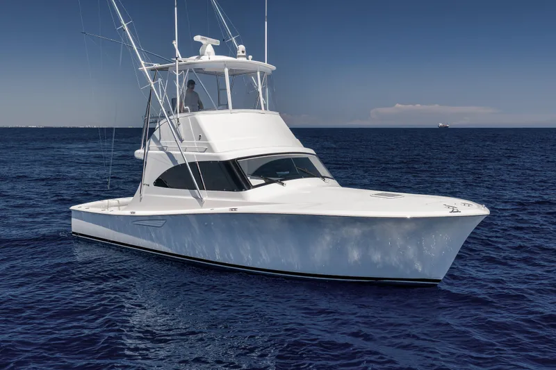 Slide: The Image of 2018 Viking 37 Billfish yacht cruising on open ocean waters. - 12