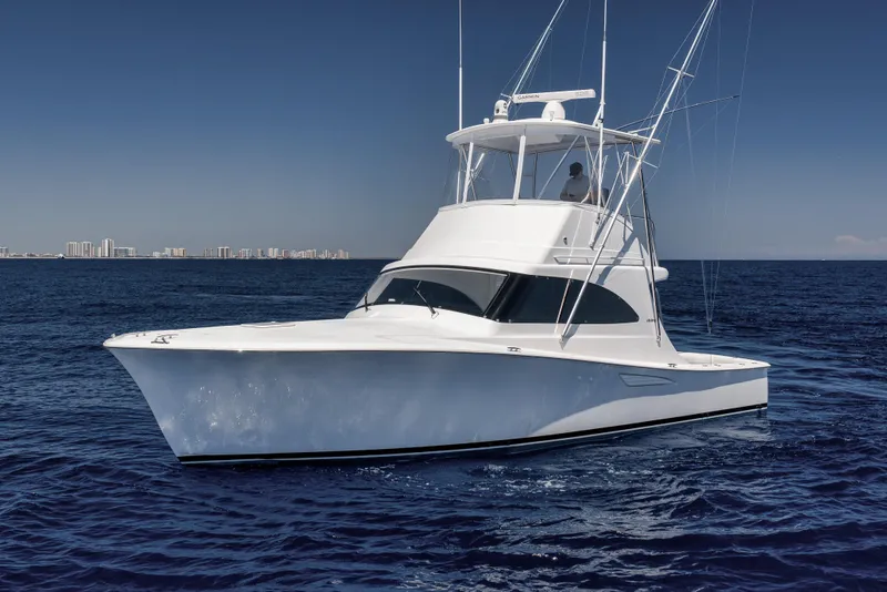 Slide: The Image of 2018 Viking 37 Billfish yacht cruising on open ocean under clear blue sky. - 13