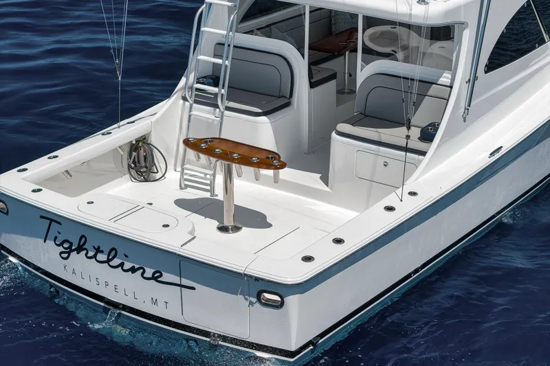 Slide: The Image of 2018 Viking 37 Billfish boat on water, featuring spacious deck and seating. - 15