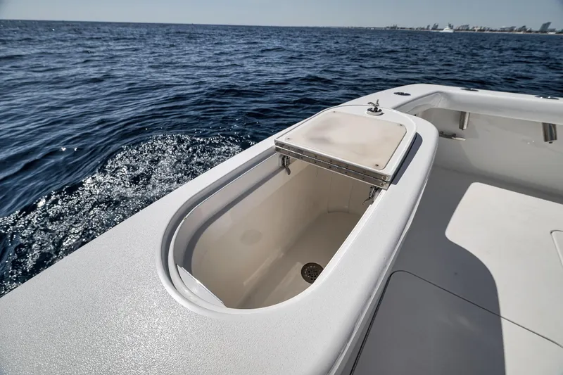 Slide: The Image of 2018 Viking 37 Billfish boat with open storage compartment on deck, ocean view. - 17