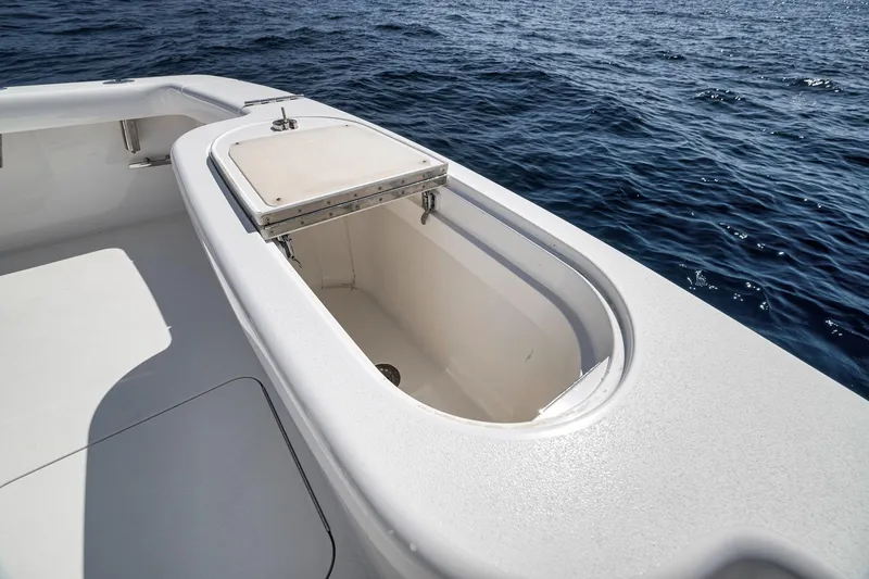 Slide: The Image of Open storage compartment on 2018 Viking 37 Billfish boat, with ocean in background. - 18