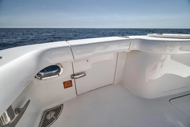 Slide: The Image of 2018 Viking 37 Billfish boat deck with ocean view, showcasing sleek design and storage compartment. - 19