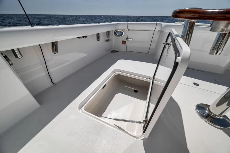 Slide: The Image of 2018 Viking 37 Billfish boat deck with open storage compartment, ocean view. - 20