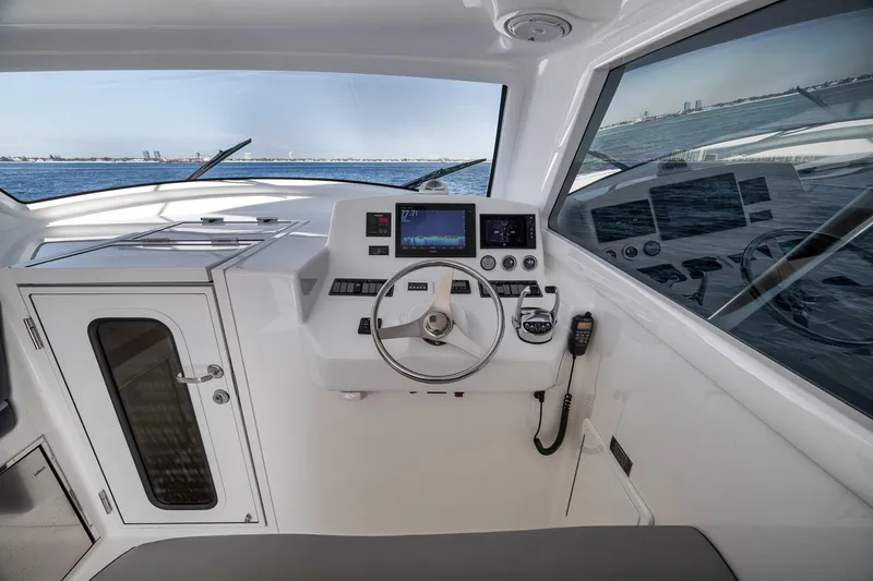 Slide: The Image of Helm of 2018 Viking 37 Billfish yacht with modern navigation equipment. - 34